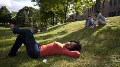 Teen girl laying on grass, pondering advice she has received