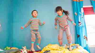 Kids with combined-type ADHD expend some energy jumping on the bed.