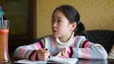 A young girl experiencing frustration during homework time