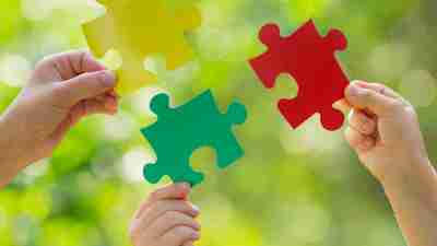 Puzzle pieces that fit together are a metaphor for piecing together symptoms of autism spectrum disorder.