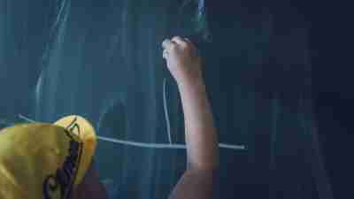 ADHD boy writing on a school chalk board