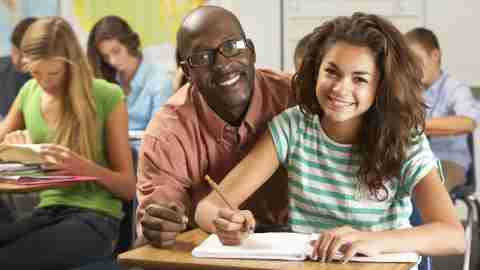 ADHD Strategies: A teacher helping a student with ADHD using the appropriate teaching strategies